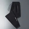 Men Plus Size Long Pants Black Breathable Stretch Sports Running Zipper Pockets Elastic Waist Drawstring Jogger Casual Pants